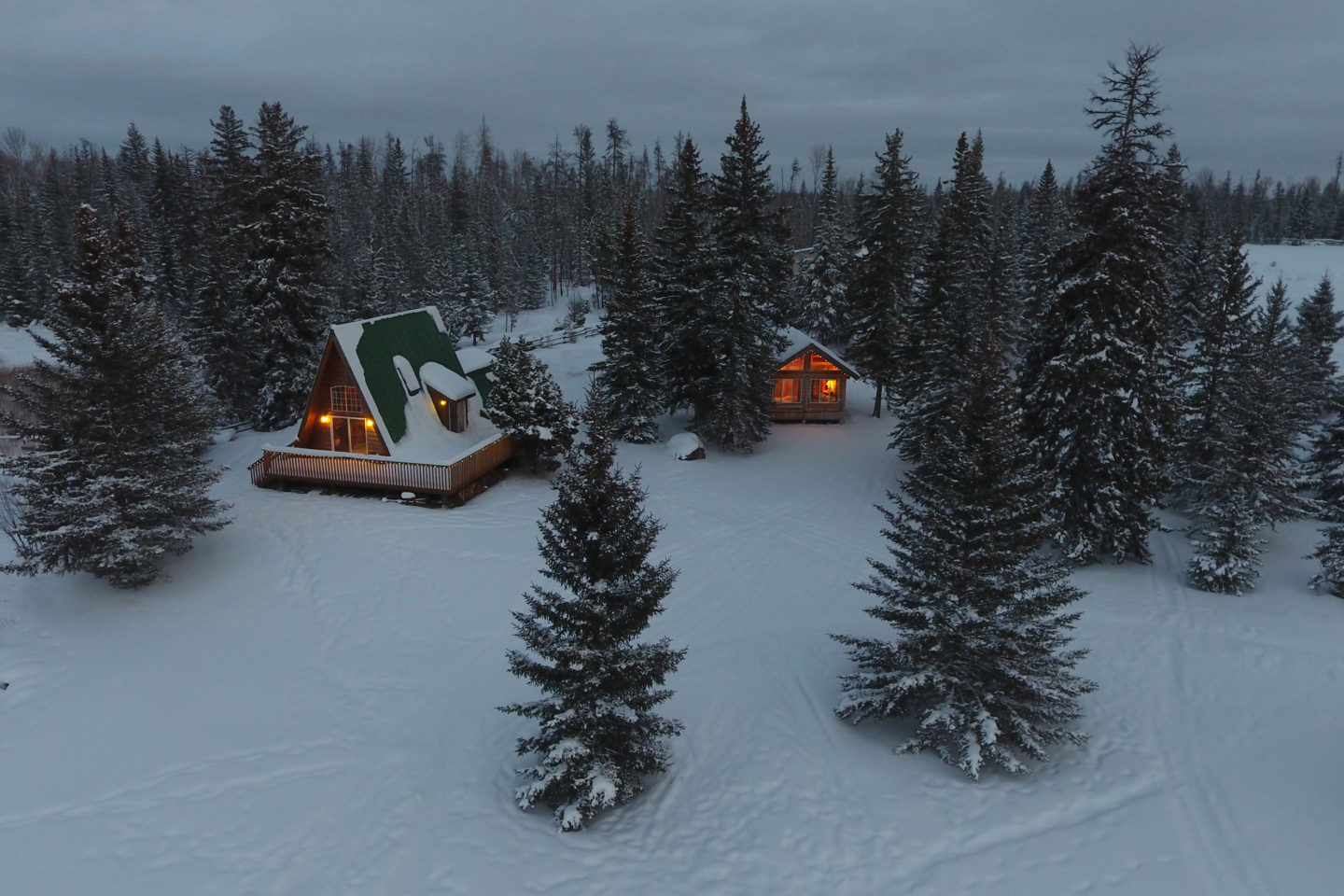fireplaces inside cozy cabins light up two cabins just before dark